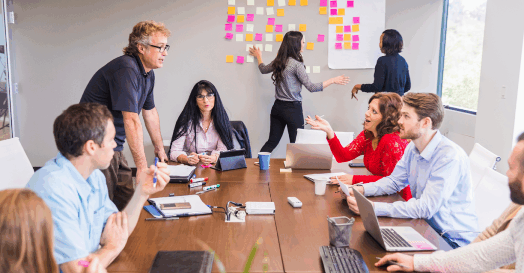 CFOs and executives brainstorming growth initiatives in a conference setting 