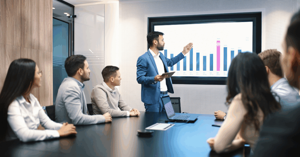 CFO reviewing digital dashboards and collaborating with IT and operations